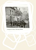 Canadian soldiers tried to extinguish a fire in a street in the center town burnt out by Germans
